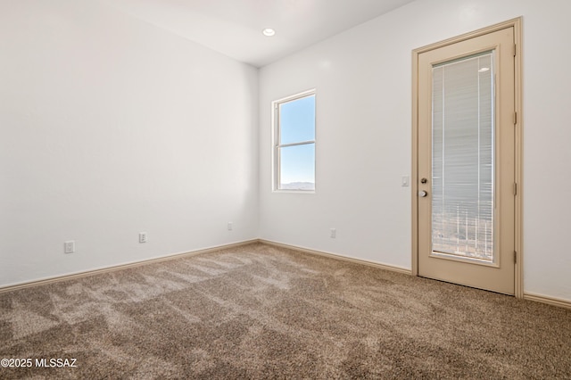 unfurnished room featuring carpet floors