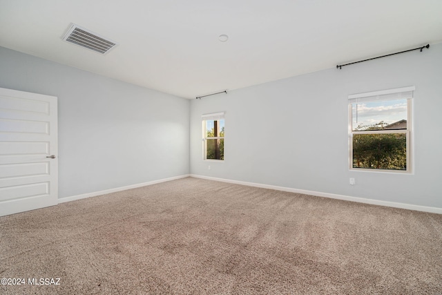 unfurnished room featuring carpet flooring