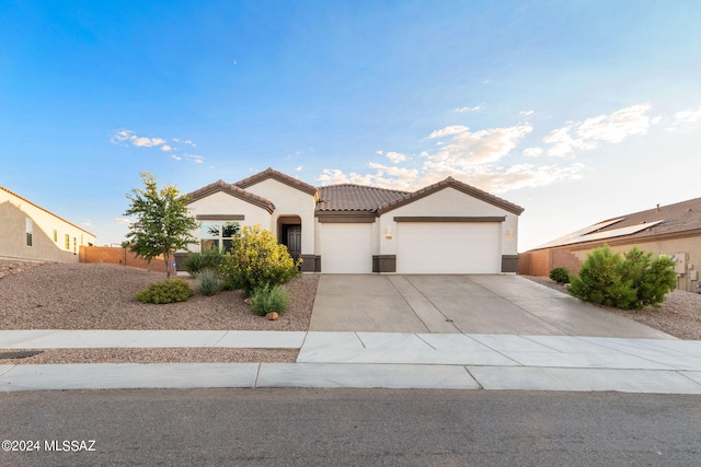 view of front of property with a garage