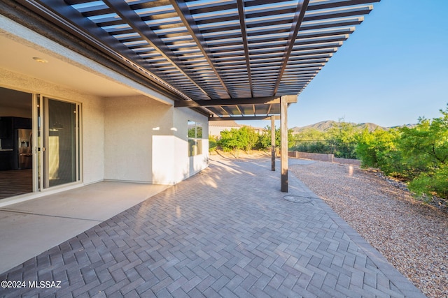 view of patio featuring a mountain view and a pergola