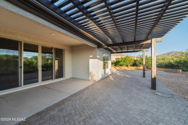 view of patio with a mountain view and a pergola