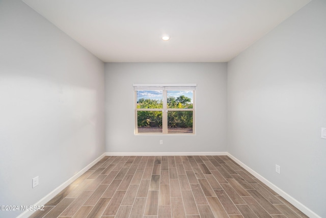 empty room with wood-type flooring