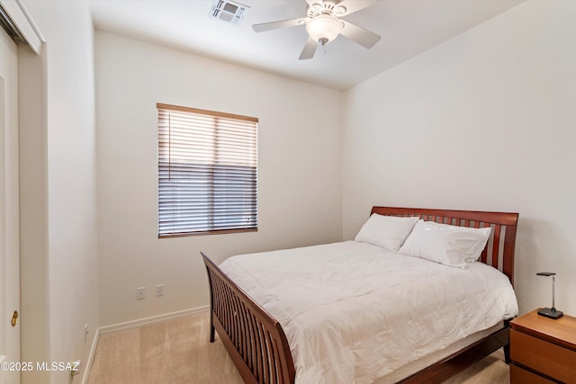 bedroom featuring light colored carpet and ceiling fan