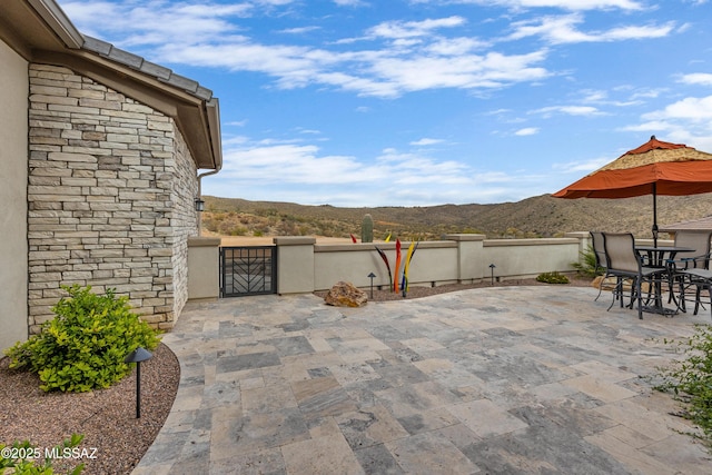 view of patio / terrace with a mountain view