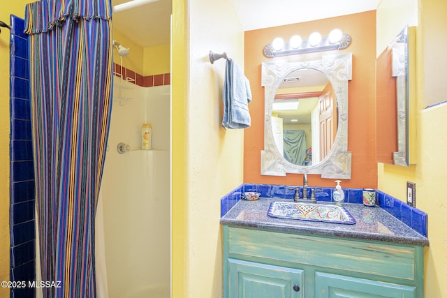 bathroom featuring vanity and walk in shower