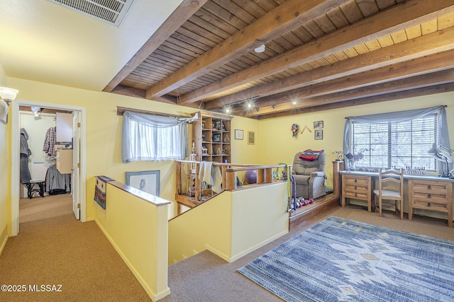 carpeted bedroom featuring wood ceiling and beamed ceiling