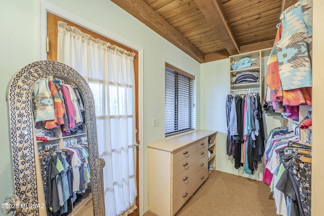 spacious closet with light carpet and beamed ceiling