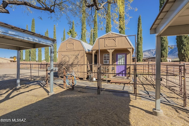 view of yard with a mountain view and an outdoor structure