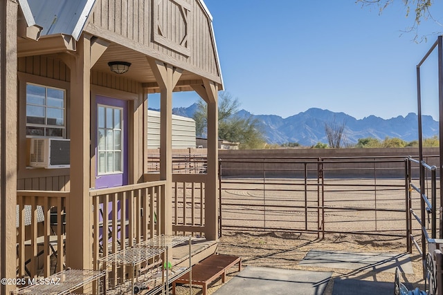 exterior space with cooling unit and a mountain view