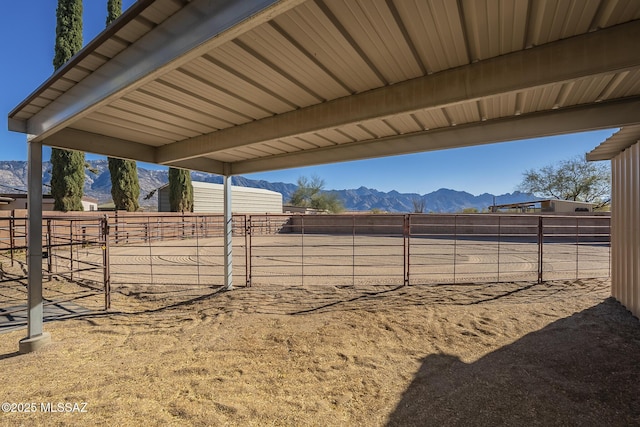 view of yard featuring an outbuilding and a mountain view