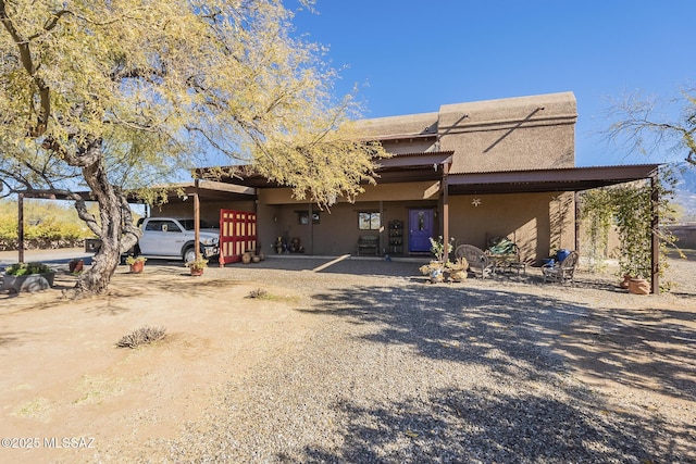 view of front of house with a carport