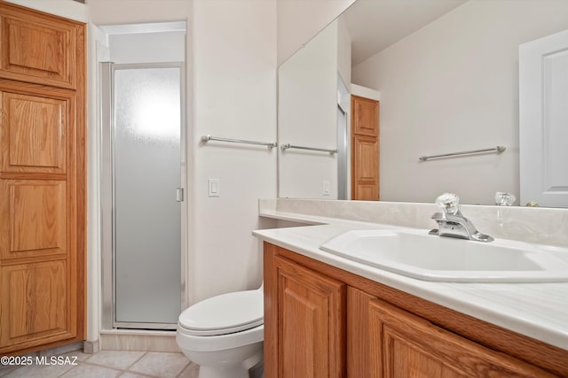 bathroom with toilet, tile patterned flooring, a shower with shower door, and vanity