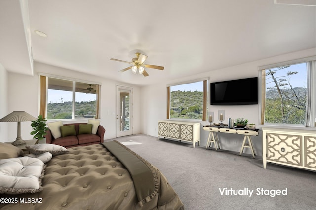 bedroom with carpet, access to exterior, and ceiling fan