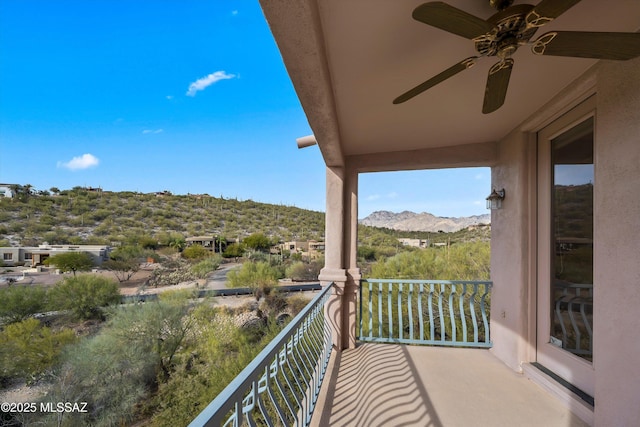 balcony with ceiling fan and a mountain view