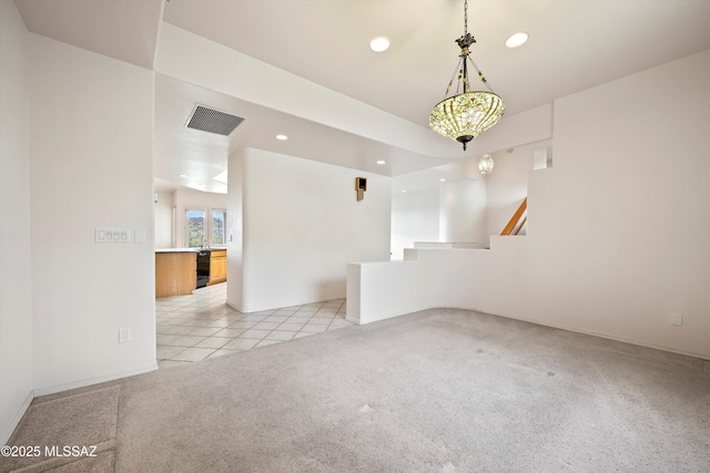 unfurnished living room with light carpet