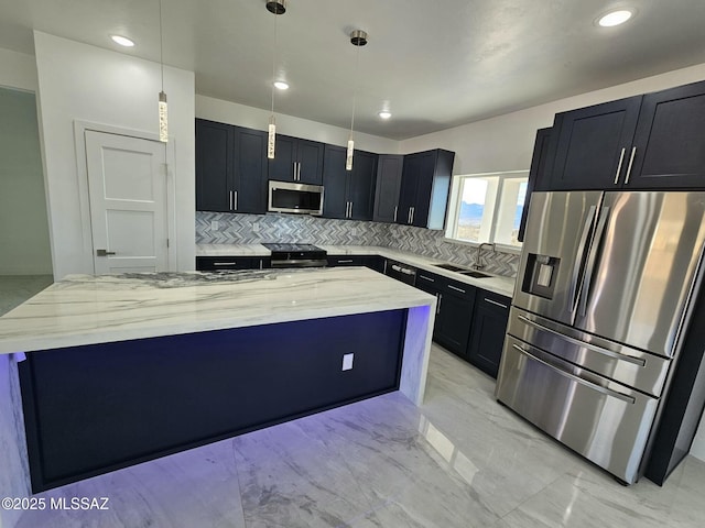 kitchen featuring a kitchen island, appliances with stainless steel finishes, light stone counters, marble finish floor, and a sink