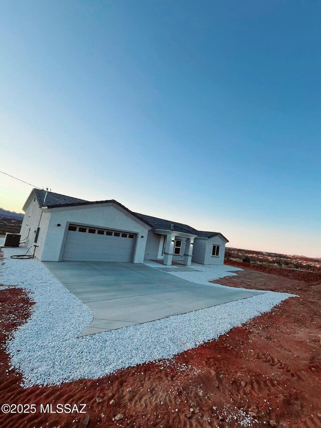 view of front facade featuring a mountain view and a garage