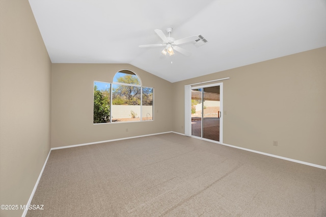 carpeted empty room featuring ceiling fan and lofted ceiling