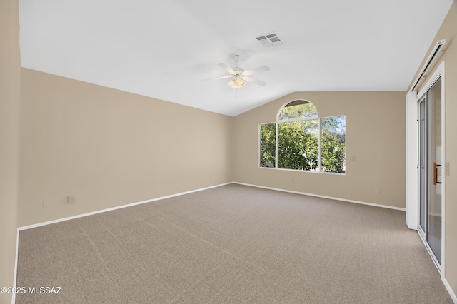 unfurnished bedroom with vaulted ceiling, ceiling fan, and light carpet