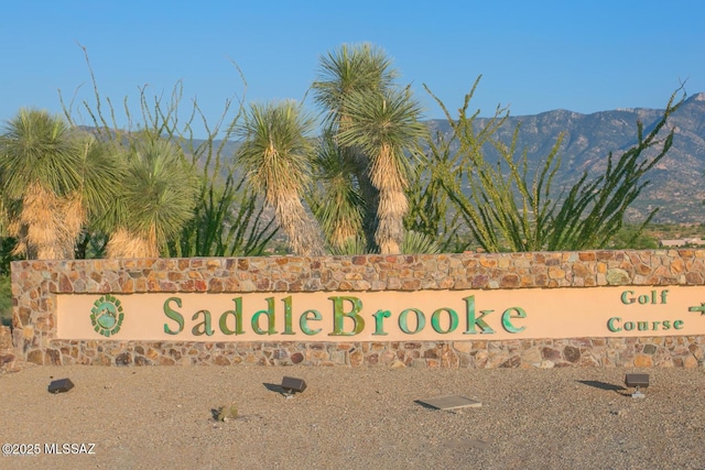 community sign featuring a mountain view