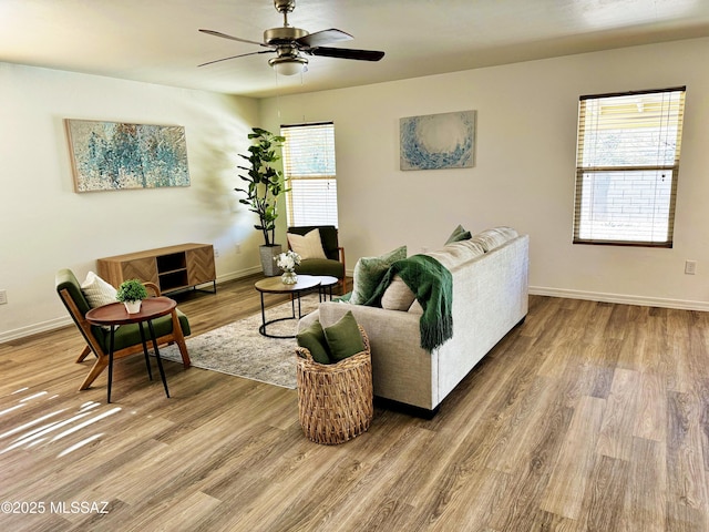 living room with hardwood / wood-style flooring and ceiling fan