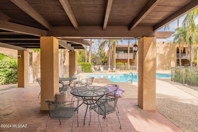 view of patio / terrace featuring a community pool