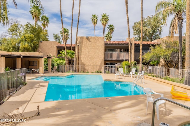 view of pool featuring a patio