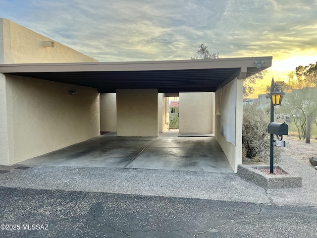 view of garage at dusk