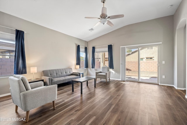 living room featuring vaulted ceiling, hardwood / wood-style floors, and ceiling fan