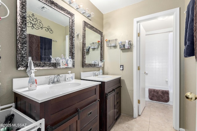 bathroom featuring tile patterned floors, shower / bathtub combination with curtain, and vanity