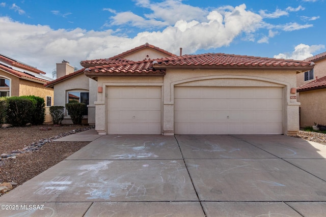 mediterranean / spanish-style house featuring a garage