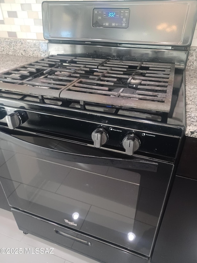 interior details featuring black range with gas stovetop