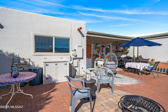 view of patio / terrace with an outdoor fire pit