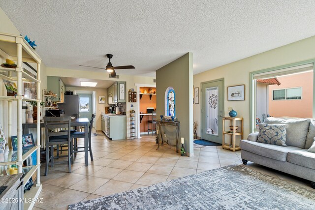 tiled living room with a textured ceiling