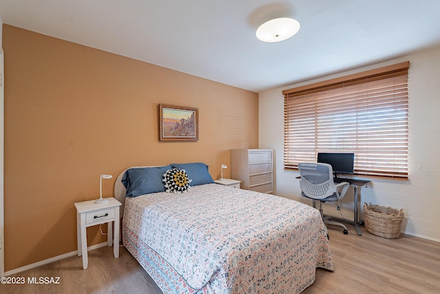 bedroom featuring hardwood / wood-style floors