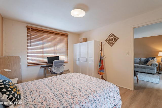 bedroom featuring light hardwood / wood-style flooring and a closet