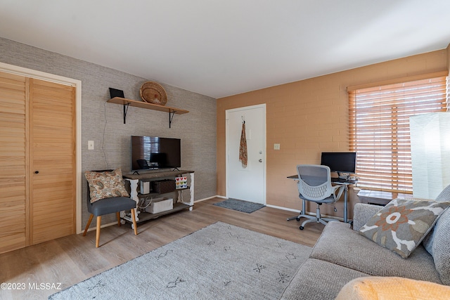 home office with hardwood / wood-style floors