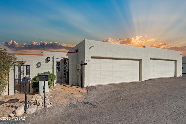 southwest-style home with a garage