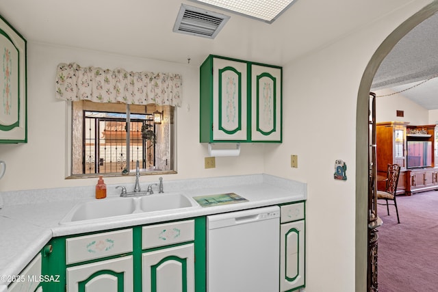 kitchen featuring carpet flooring, green cabinets, sink, and white dishwasher