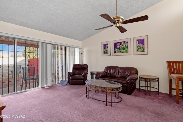 carpeted living room featuring a textured ceiling, ceiling fan, and lofted ceiling