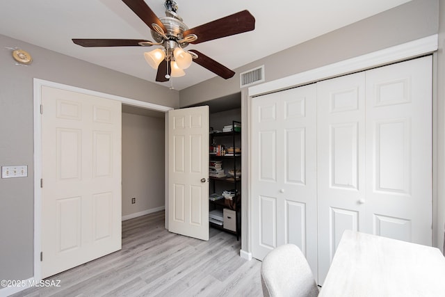 unfurnished bedroom featuring a closet, ceiling fan, and light hardwood / wood-style flooring