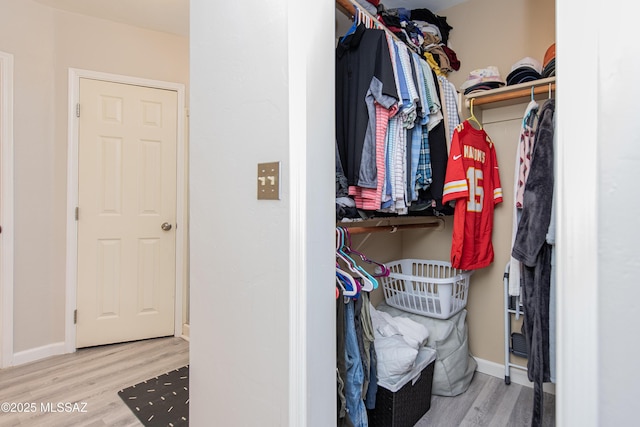 walk in closet featuring light wood-type flooring