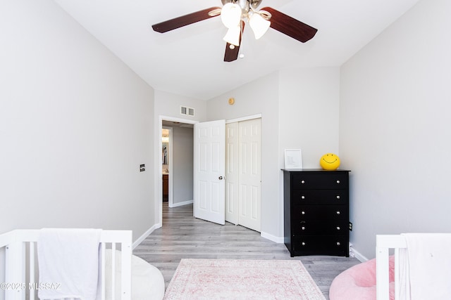 bedroom featuring a closet, ceiling fan, and light hardwood / wood-style floors