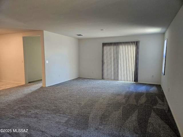 unfurnished room with carpet floors