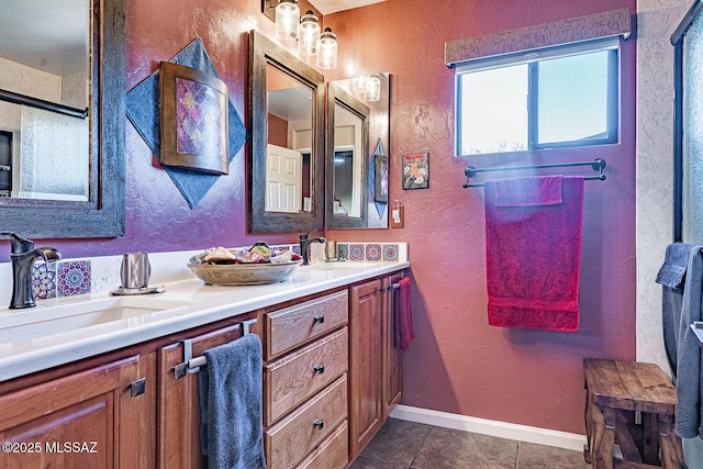 bathroom featuring tile patterned flooring and vanity