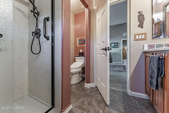 bathroom with toilet, tile patterned flooring, and an enclosed shower