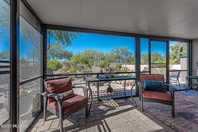 sunroom / solarium featuring a healthy amount of sunlight