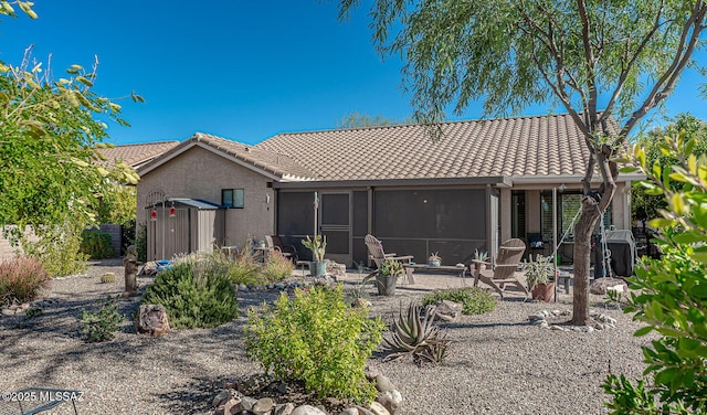 back of property featuring a patio