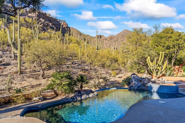 view of gate featuring a mountain view