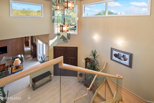 staircase with hardwood / wood-style flooring